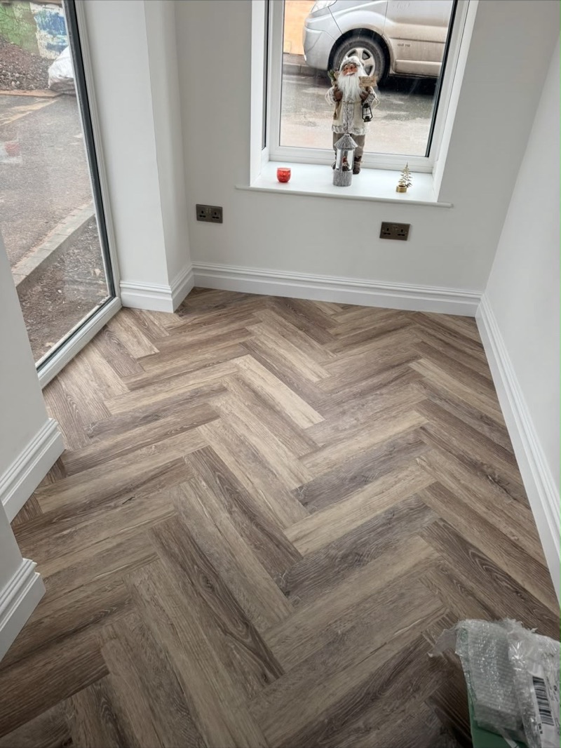 Grey herringbone luxury vinyl kitchen flooring