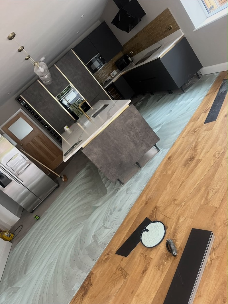 Stone and wood-effect flooring in a modern kitchen