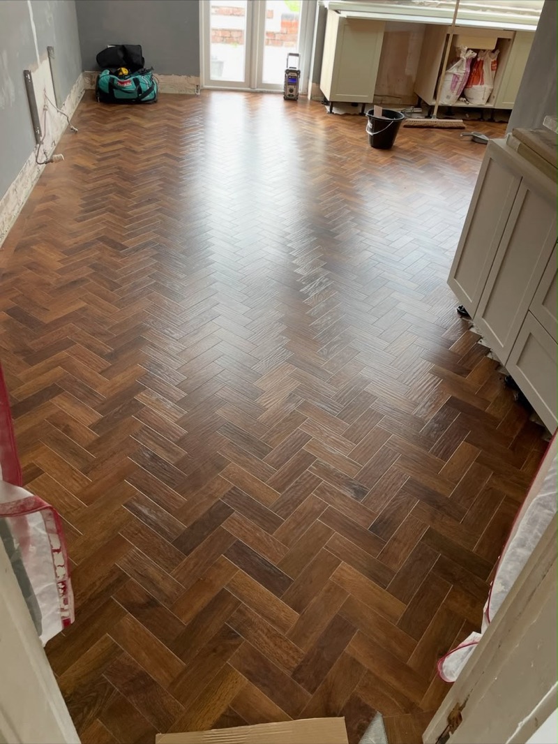 Dark parquet-style kitchen flooring