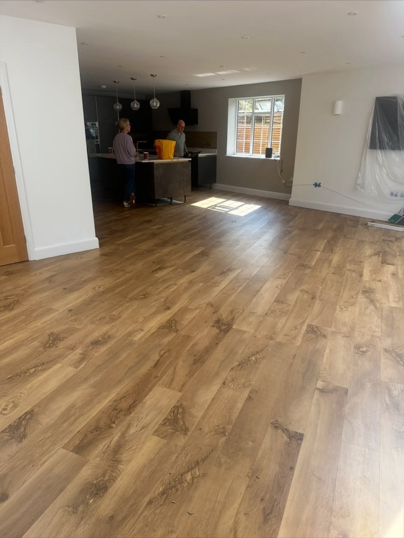 Light wood-plank luxury vinyl kitchen flooring